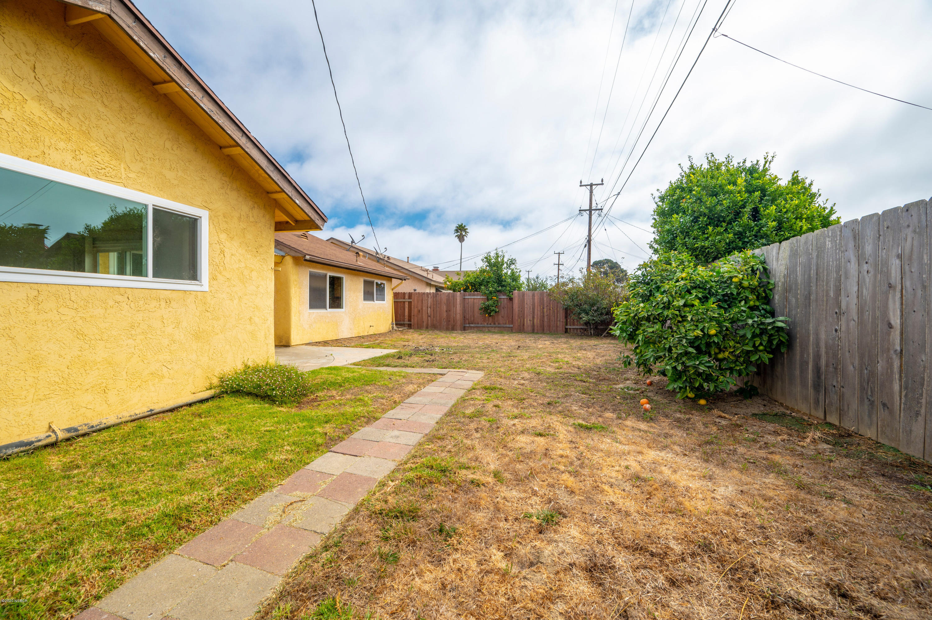 1008 West Anthony Way Lompoc, CA 93436 - Photo 25 of 26 a view of backyard of house with green space