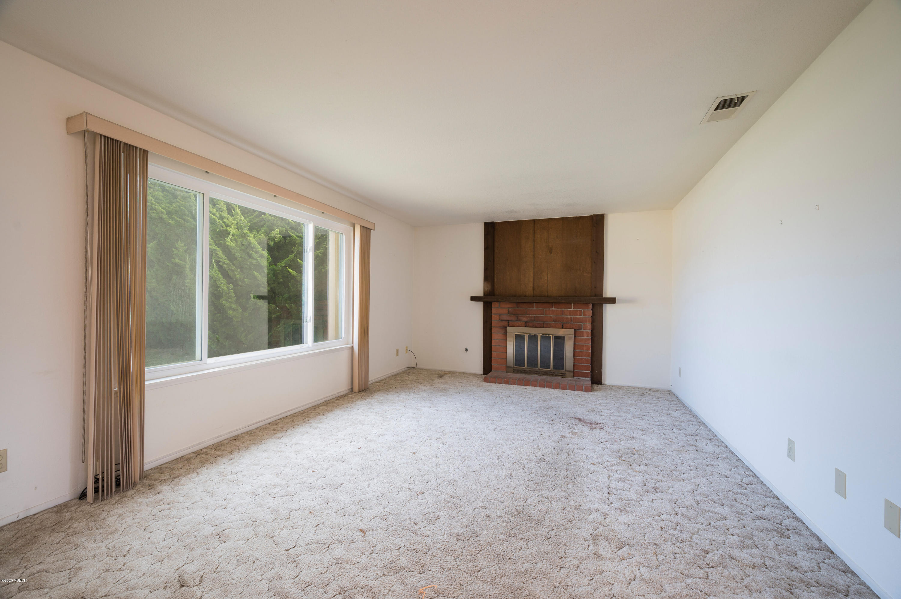 1008 West Anthony Way Lompoc, CA 93436 - Photo 3 of 26 a view of an empty room with a window