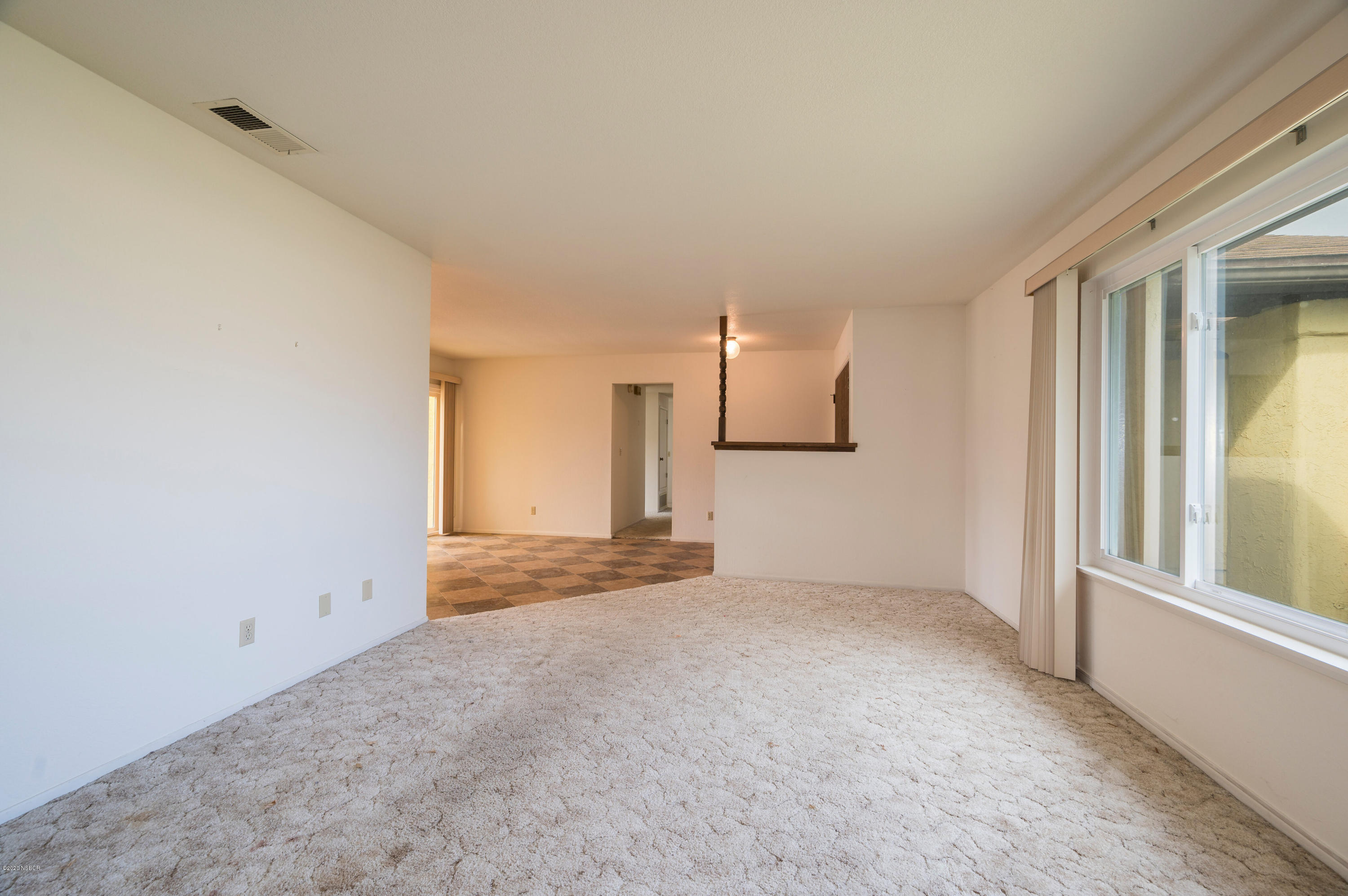 1008 West Anthony Way Lompoc, CA 93436 - Photo 4 of 26 a view of empty room with wooden floor and fan