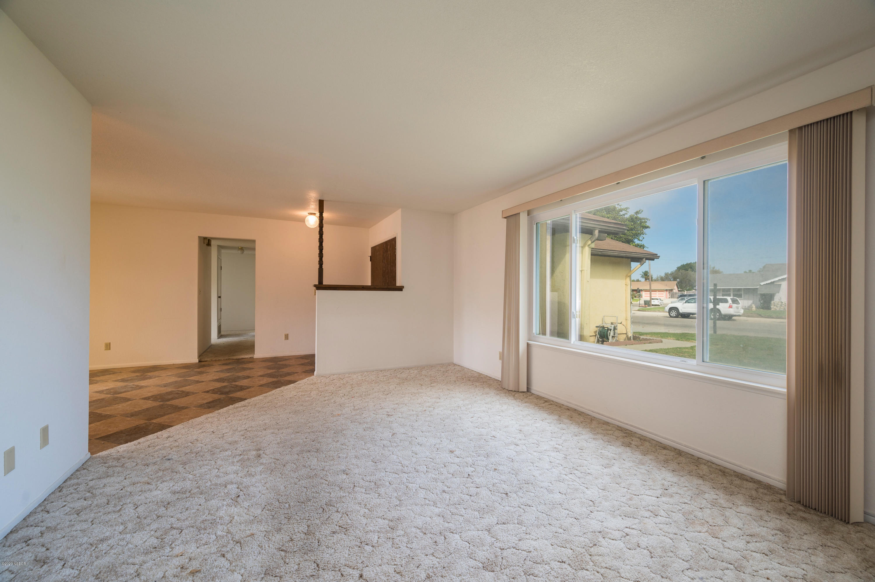 1008 West Anthony Way Lompoc, CA 93436 - Photo 5 of 26 a view of empty room with a kitchen