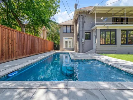 a front view of a house with swimming pool