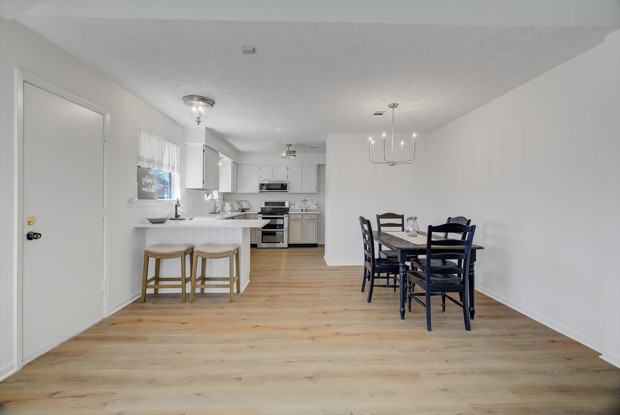 15110 Peachmeadow Lane Channelview, TX 77530 - Photo 13 of 34 a view of a dining room with furniture and wooden floor