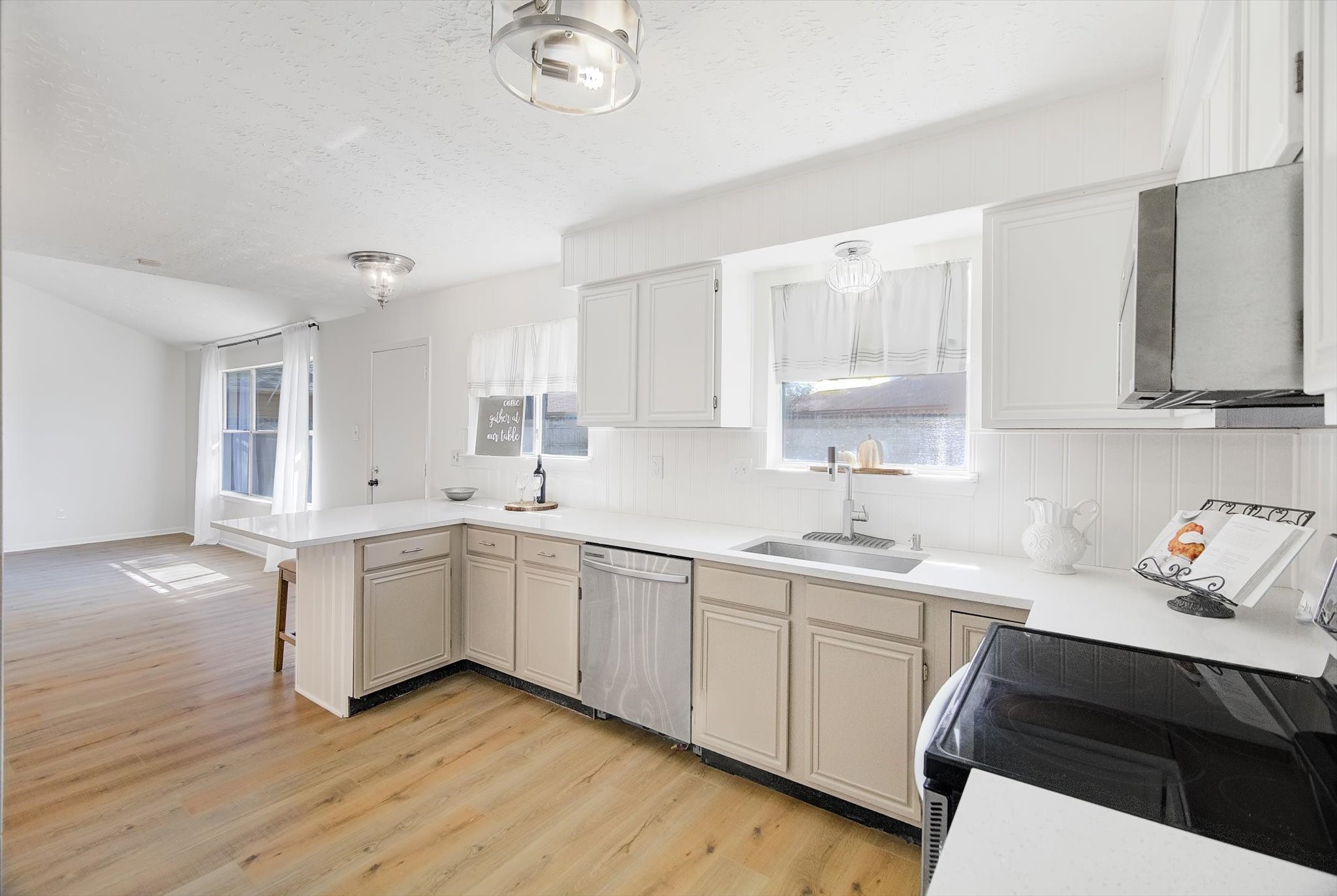 15110 Peachmeadow Lane Channelview, TX 77530 - Photo 15 of 34 a kitchen with a sink stove and cabinets