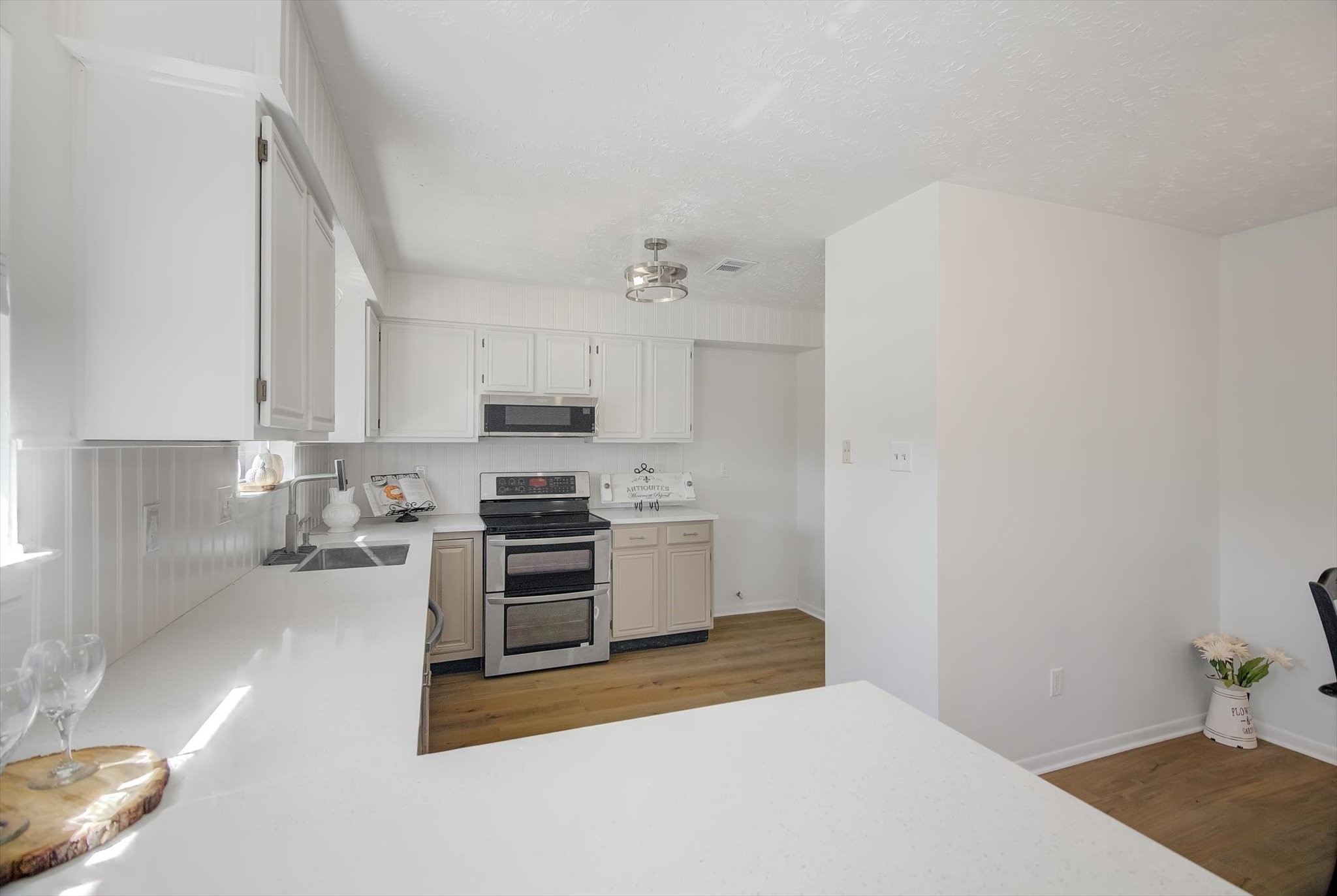 15110 Peachmeadow Lane Channelview, TX 77530 - Photo 16 of 34 a kitchen with a stove a sink and a refrigerator