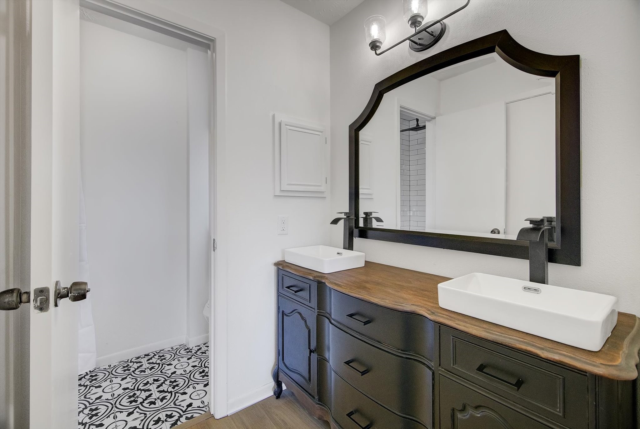 15110 Peachmeadow Lane Channelview, TX 77530 - Photo 22 of 34 a bathroom with a sink and a mirror