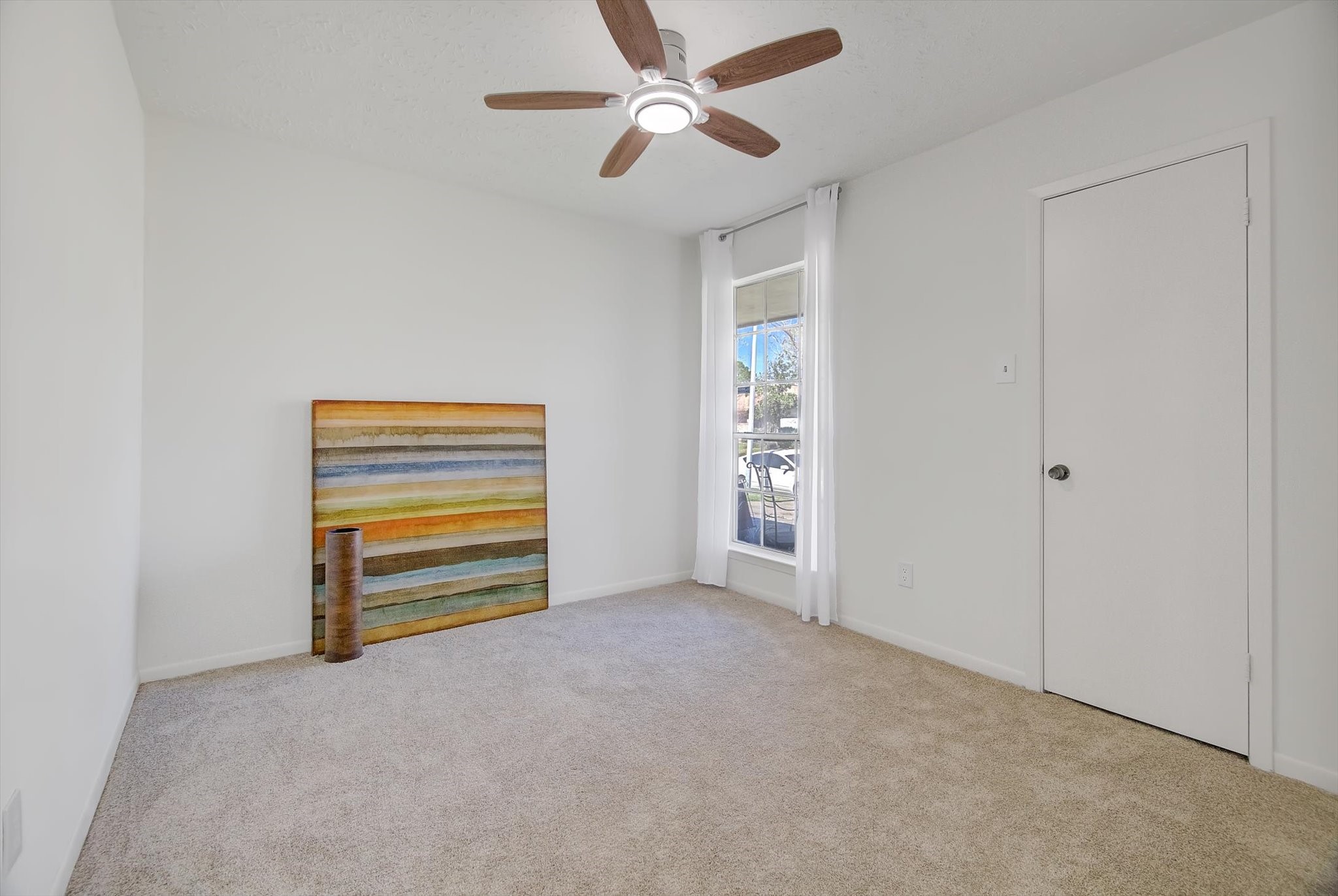 15110 Peachmeadow Lane Channelview, TX 77530 - Photo 24 of 34 an empty room with closet and a ceiling fan