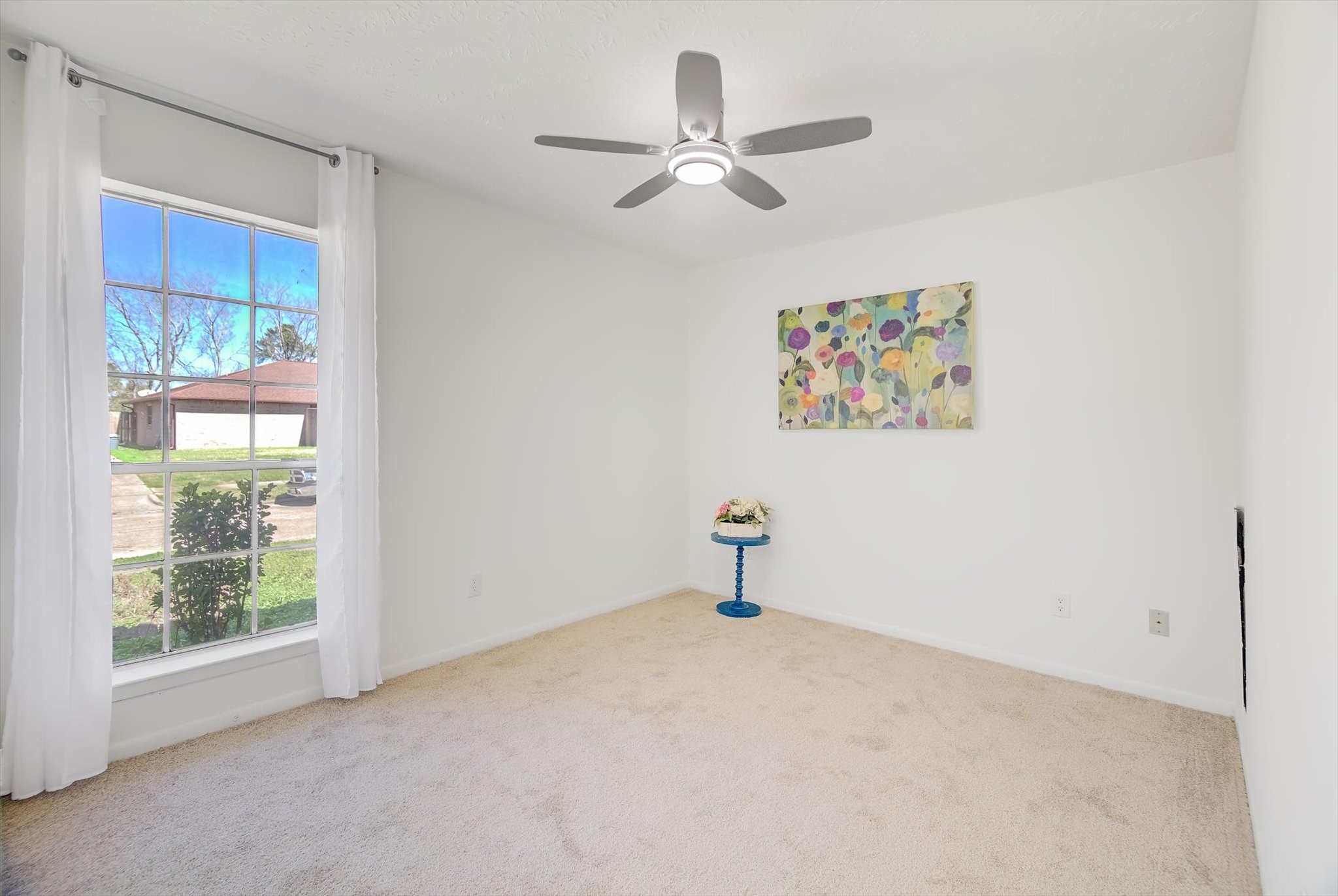 15110 Peachmeadow Lane Channelview, TX 77530 - Photo 26 of 34 a view of a livingroom with a ceiling fan and window