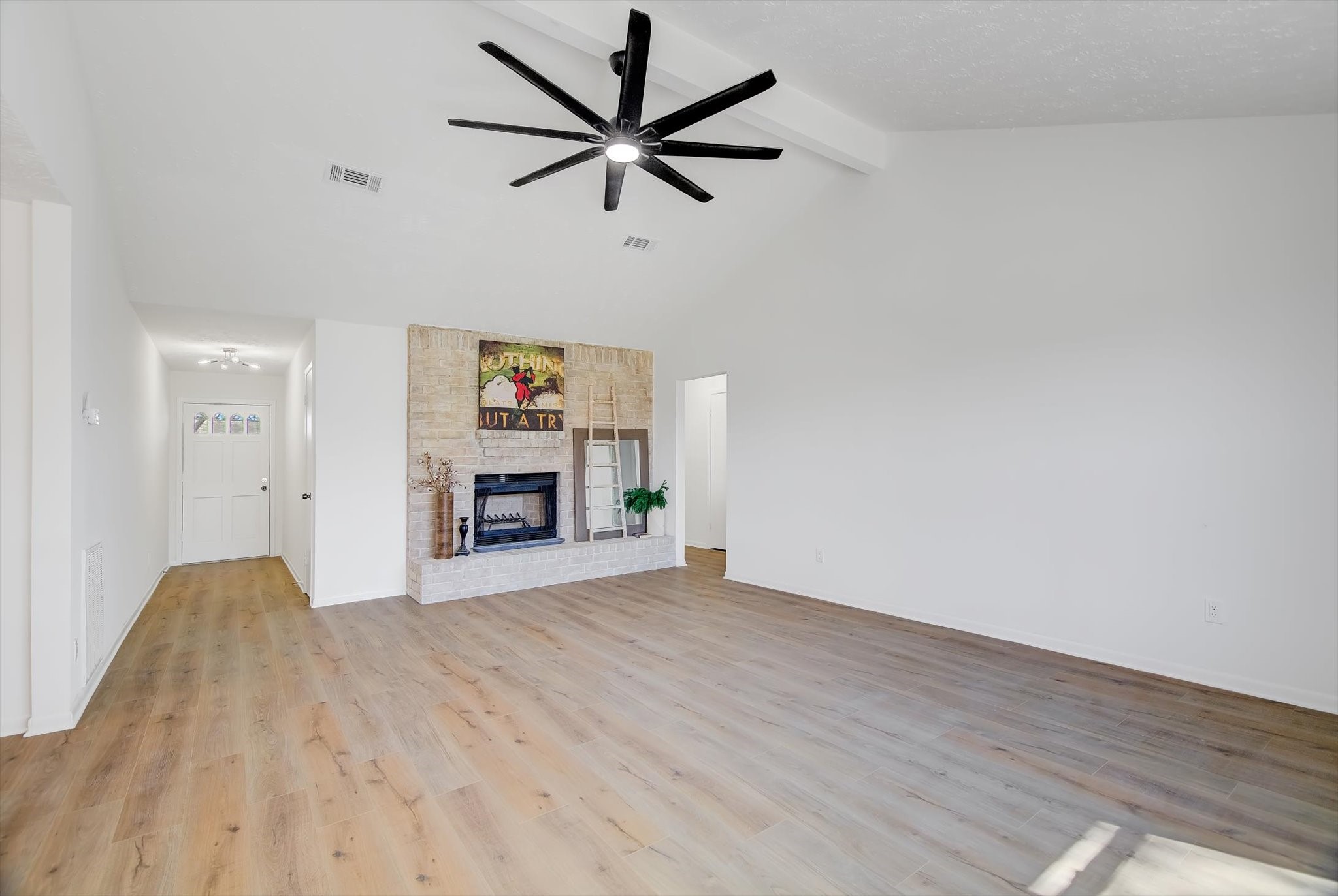 15110 Peachmeadow Lane Channelview, TX 77530 - Photo 5 of 34 a view of a livingroom with a ceiling fan a ceiling fan and wooden floor