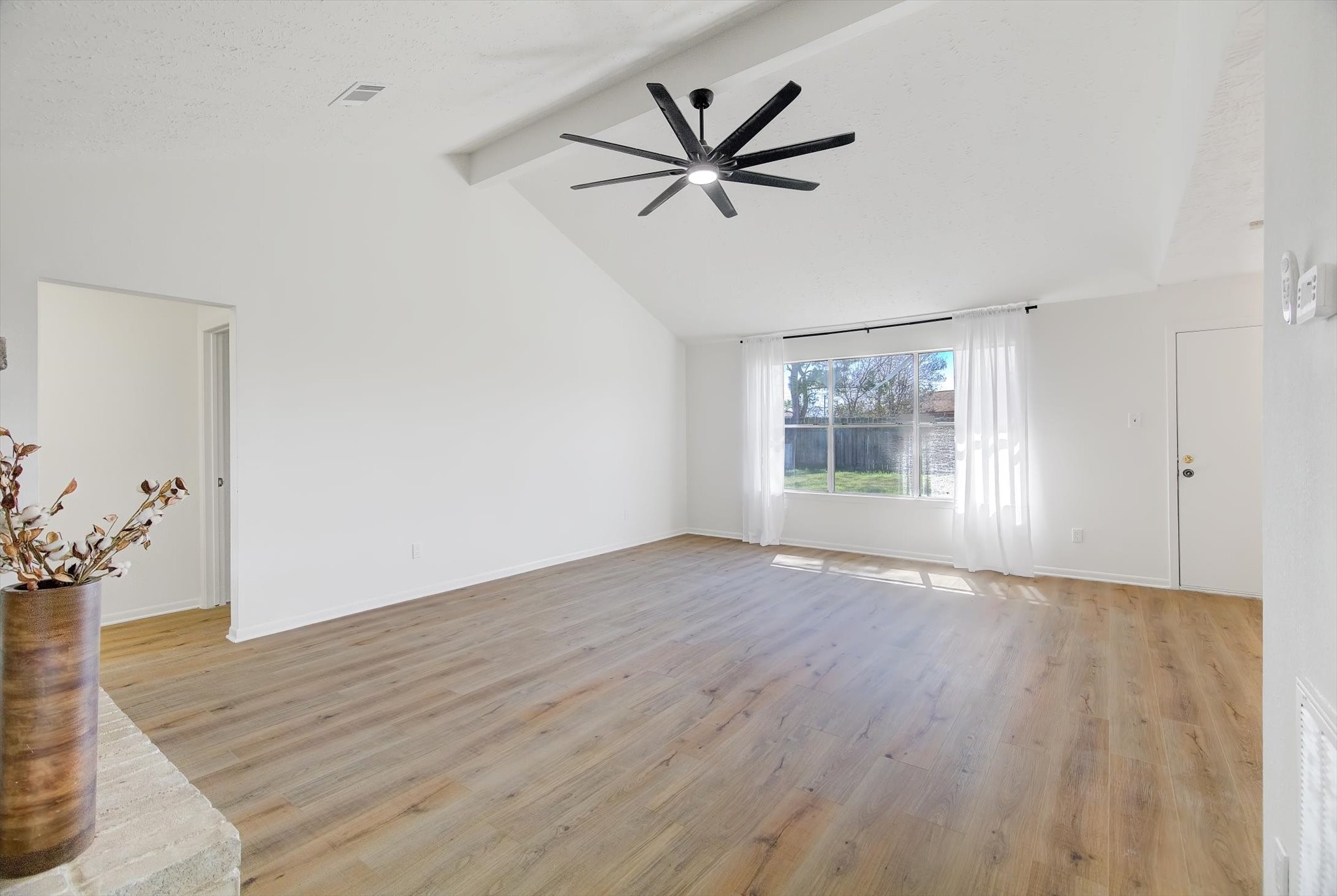 15110 Peachmeadow Lane Channelview, TX 77530 - Photo 7 of 34 a view of empty room with wooden floor and ceiling fan