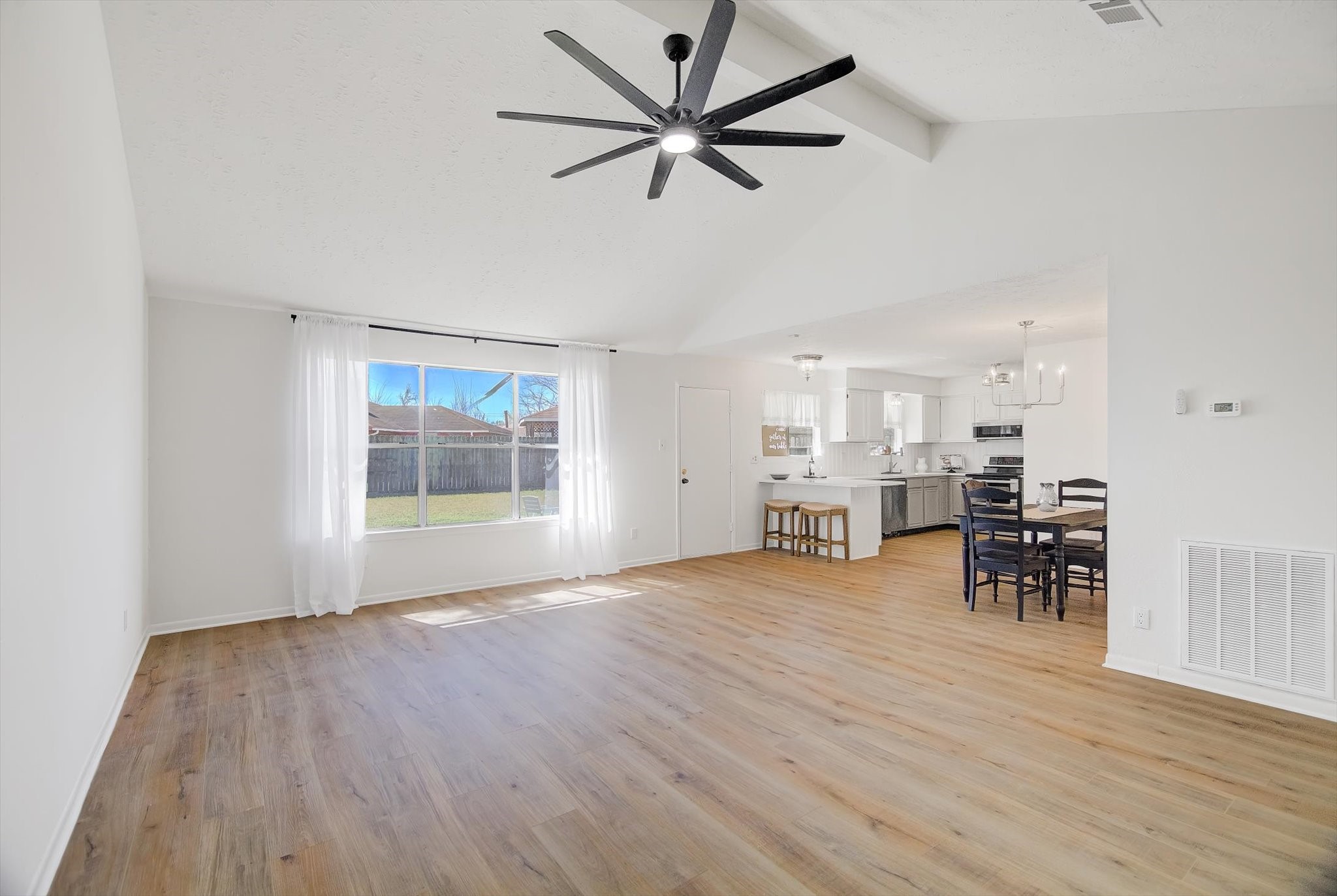 15110 Peachmeadow Lane Channelview, TX 77530 - Photo 8 of 34 a view of a livingroom with furniture wooden floor and a ceiling fan