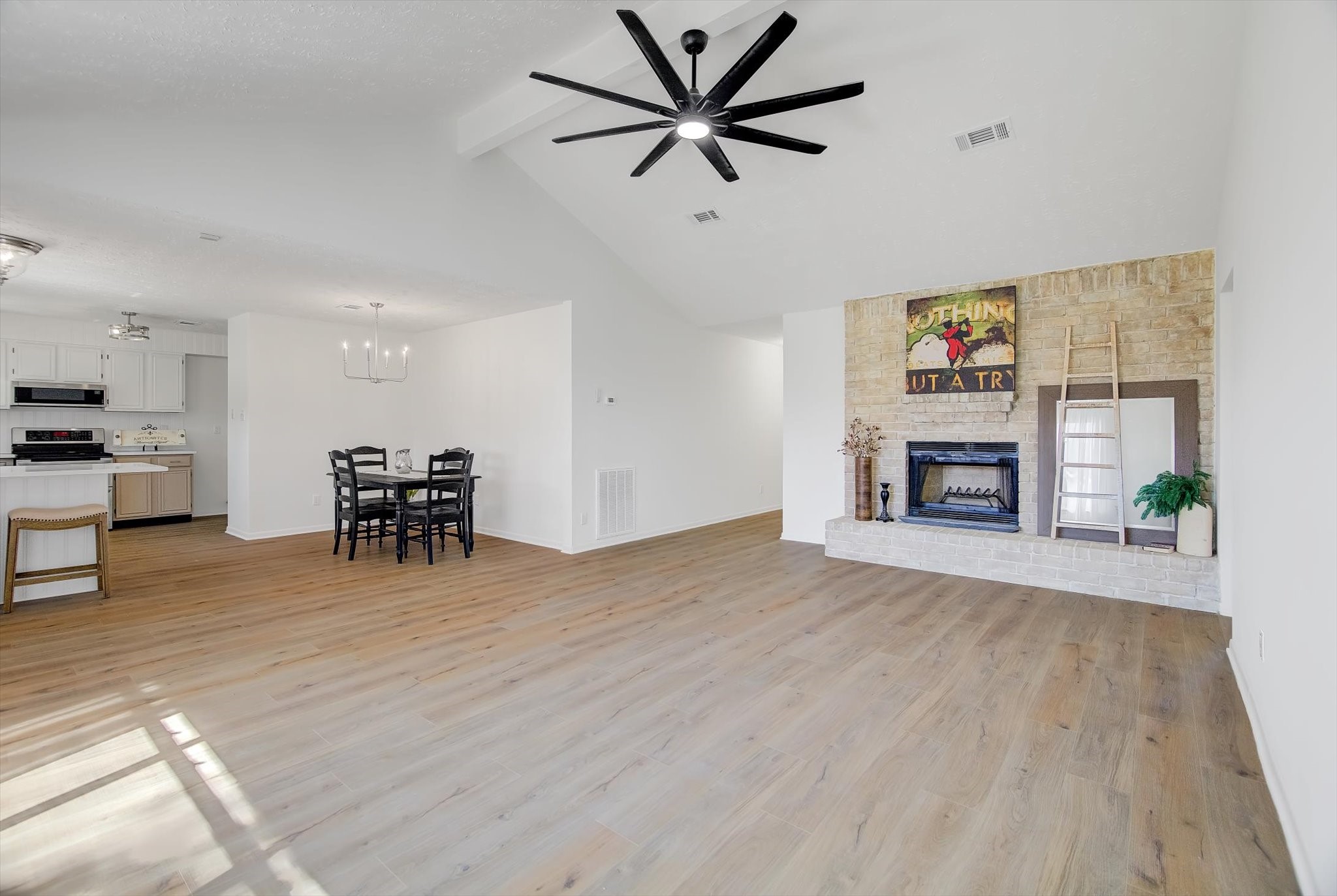 15110 Peachmeadow Lane Channelview, TX 77530 - Photo 9 of 34 a view of a livingroom with furniture and a kitchen with wooden floor