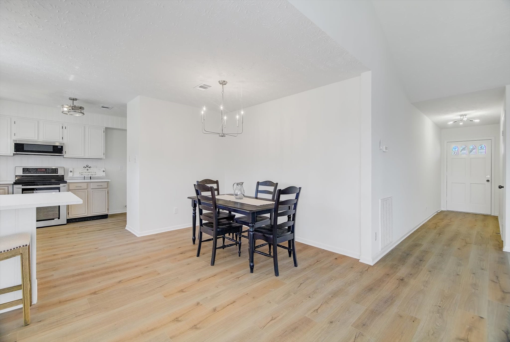 15110 Peachmeadow Lane Channelview, TX 77530 - Photo 10 of 34 a view of a dining room with furniture and wooden floor