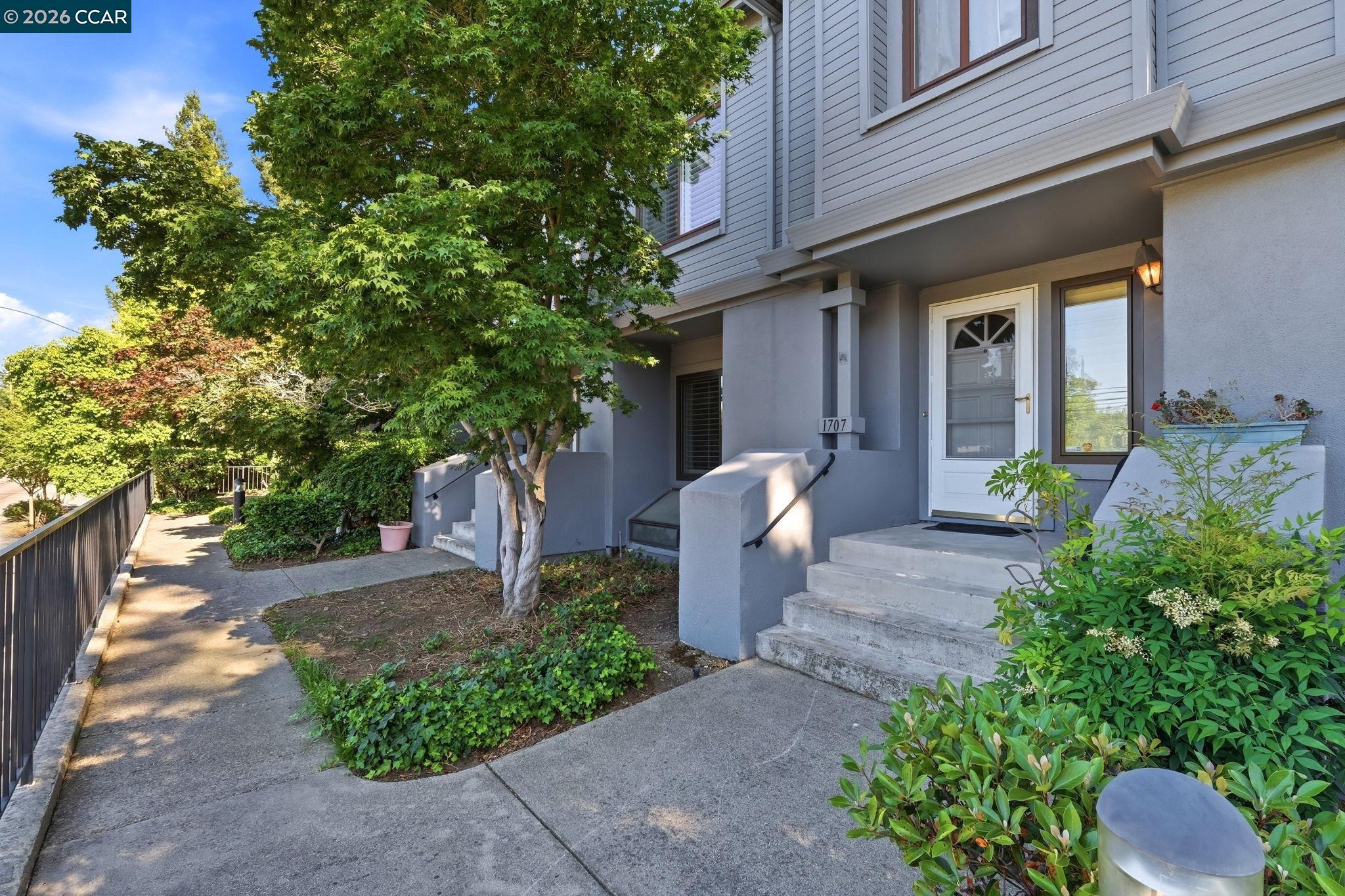 1707 Geary Road Walnut Creek, CA 94597 - Photo 4 of 43 a front view of a house with a yard