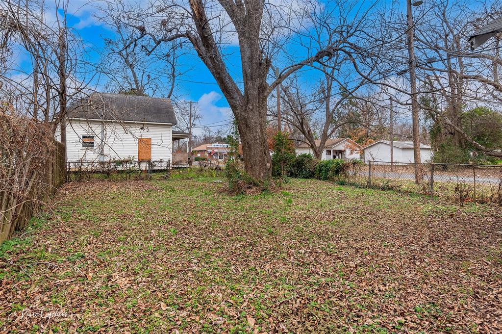 329 Edwards Street Bossier City, LA 71111 - Photo 11 of 12 a view of a house with a yard