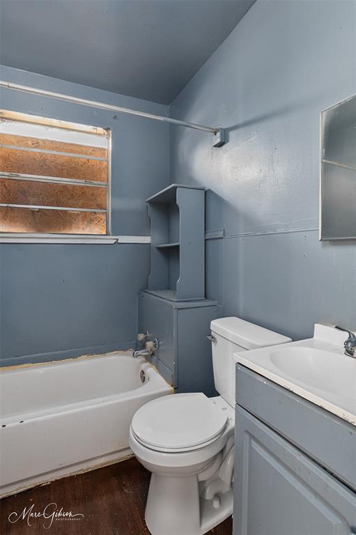 329 Edwards Street Bossier City, LA 71111 - Photo 8 of 12 a bathroom with a sink a toilet and bathtub