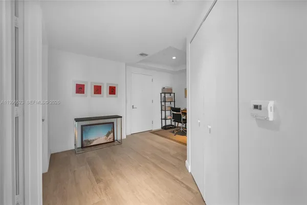 a view of an empty room with a fireplace