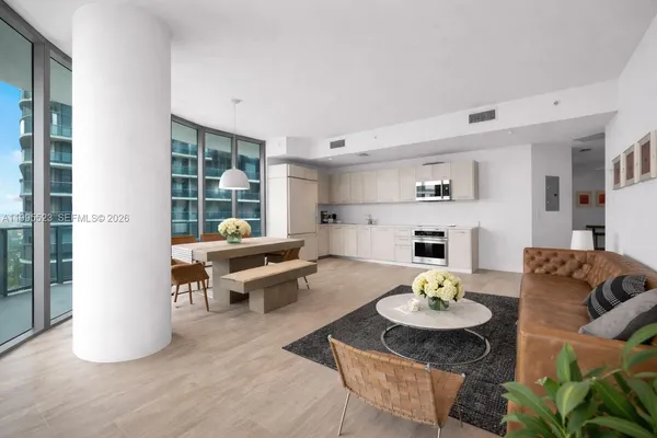 a living room with furniture and a table