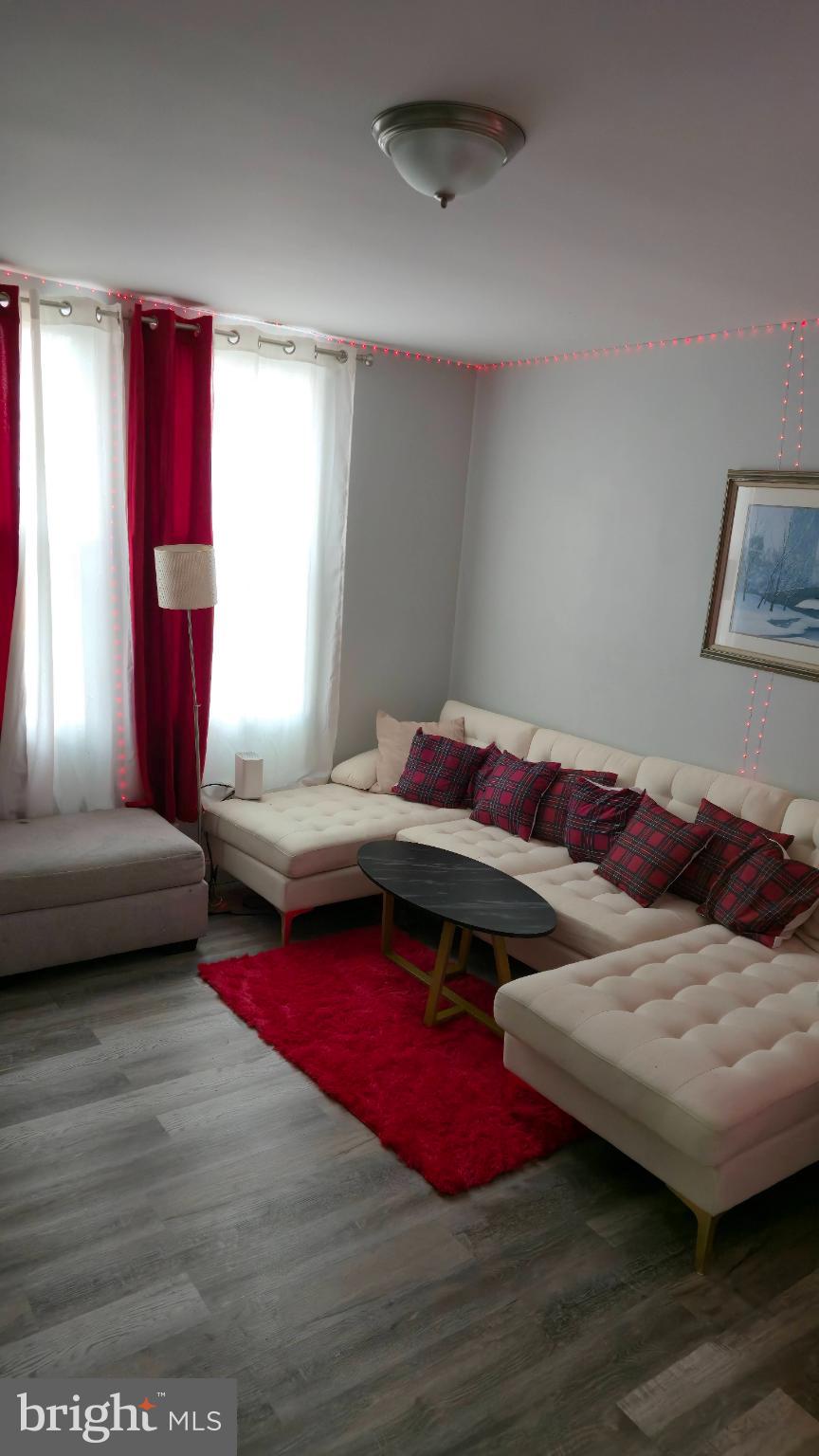 2413 Reisterstown Road Baltimore, MD 21217 - Photo 11 of 22 a living room with furniture and a couch