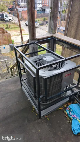 a view of a kitchen with a sink oven cabinets and a refrigerator