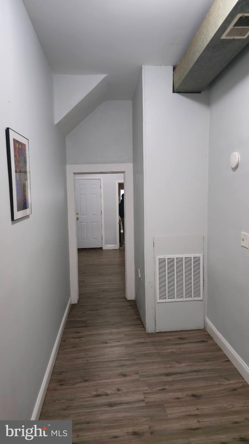 2413 Reisterstown Road Baltimore, MD 21217 - Photo 2 of 22 a view of a hallway with wooden floor