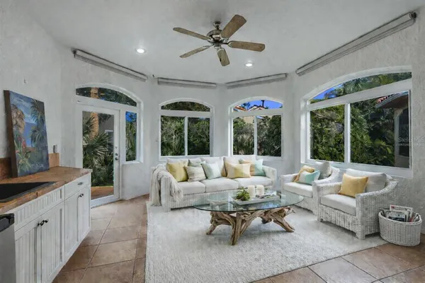 a bathroom with a tub shower vanity and a sink
