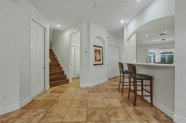a bathroom with a sink a large mirror and a shower