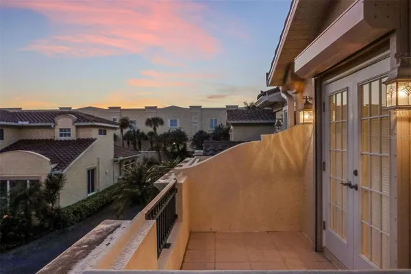 a front view of a house with swimming pool having outdoor seating