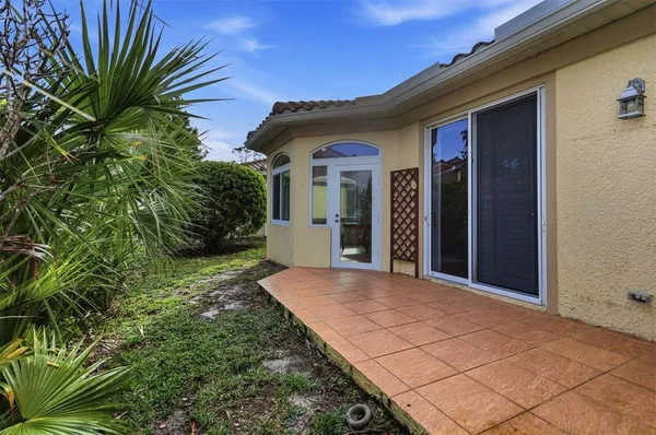 a view of a swimming pool with sitting area and garden