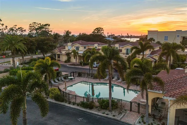 a view of a balcony with wooden floor and lake view