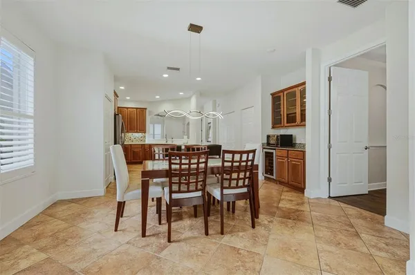 a kitchen with a table and chairs in it