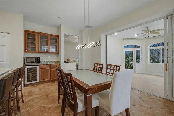 a spacious bathroom with a granite countertop sink and a mirror