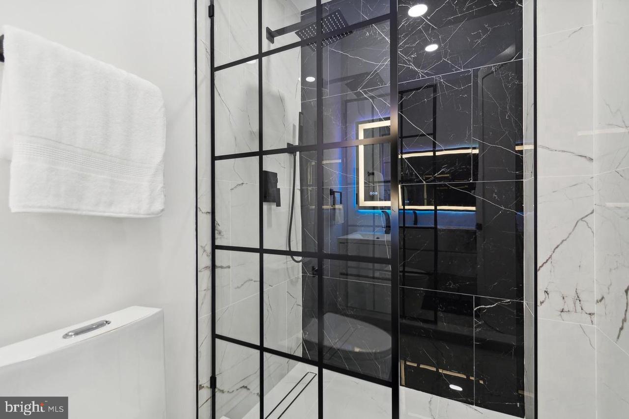 705 Quincy Street Northeast, Unit 4 Washington, DC 20017 - Photo 5 of 7 a bathroom with a shower