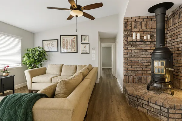 a living room with furniture and wooden floor