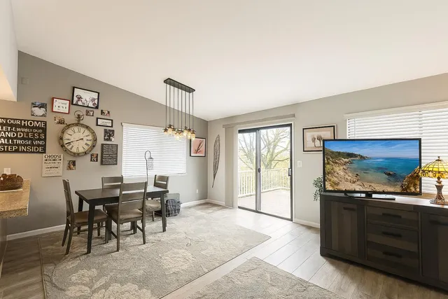 a dining room with furniture and window