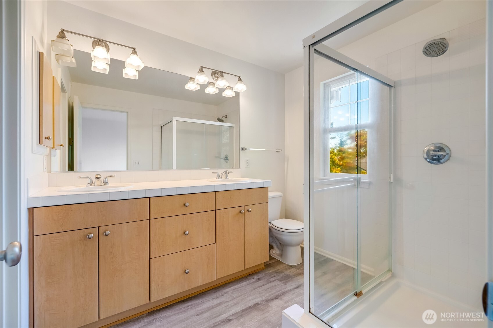 4740 Lake Place South, Unit A Renton, WA 98055 - Photo 15 of 24 a spacious bathroom with a granite countertop sink mirror and toilet
