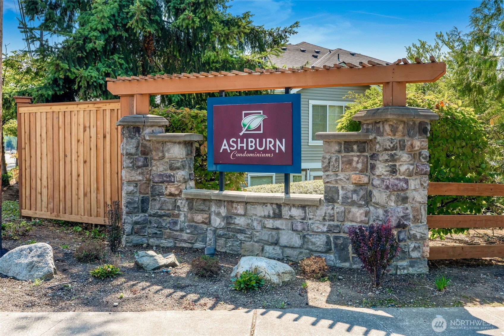 4740 Lake Place South, Unit A Renton, WA 98055 - Photo 2 of 24 a sign on the side of a brick building