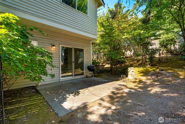 a view of a backyard with sitting area