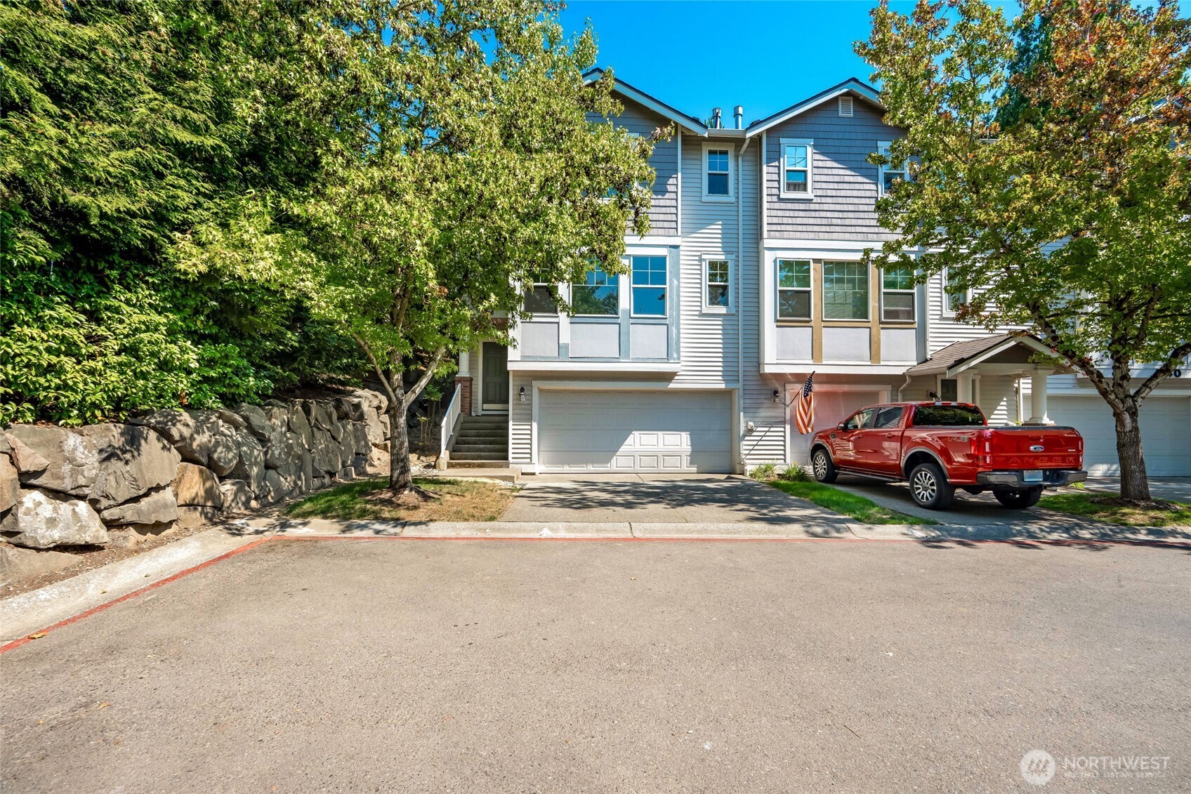 4740 Lake Place South, Unit A Renton, WA 98055 - Photo 3 of 24 a car parked in front of a house