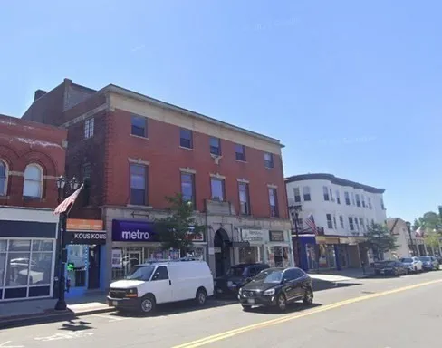 a front view of a building with street view