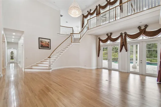 a view of an empty room and wooden floor