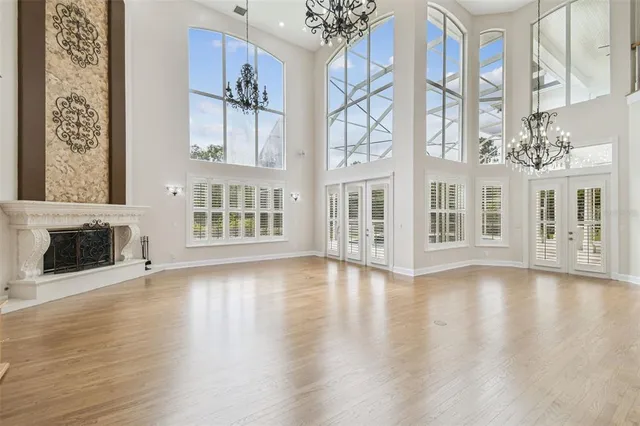 a bathroom with a granite countertop shower a toilet and a sink