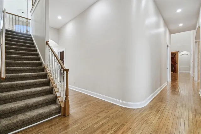 an aerial view of residential houses with outdoor space and street view
