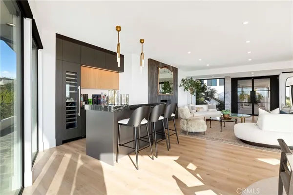 a view of kitchen with cabinets and wooden floor