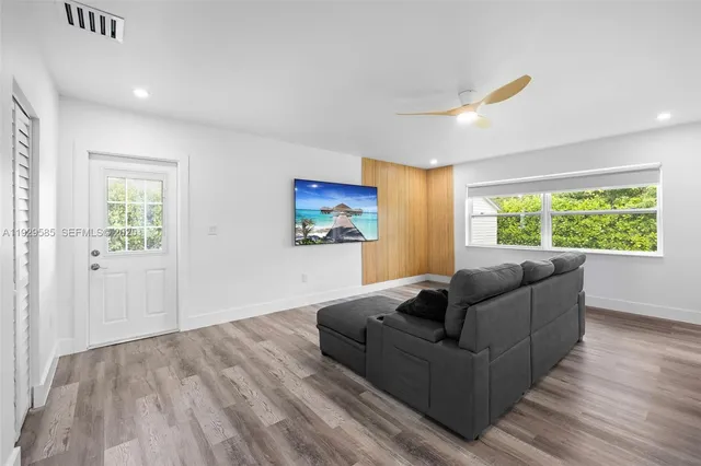 a living room with furniture and a window