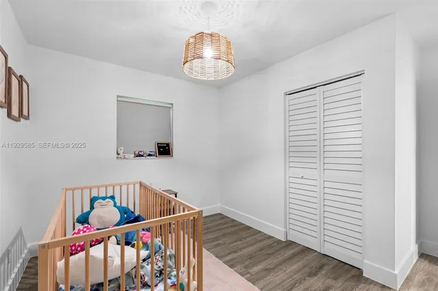 a bathroom with a sink a mirror a bathtub and shower