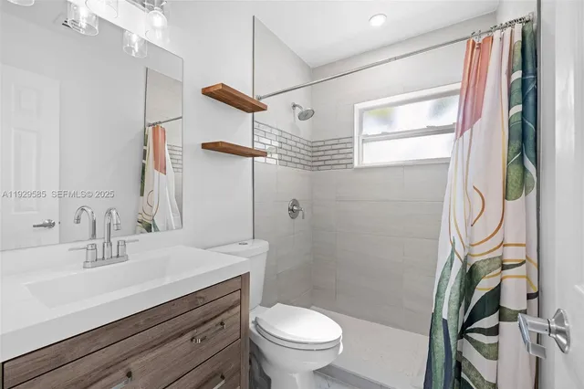 a room with a bed and flat screen tv