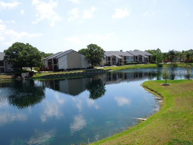 a view of a lake with a house in the background
