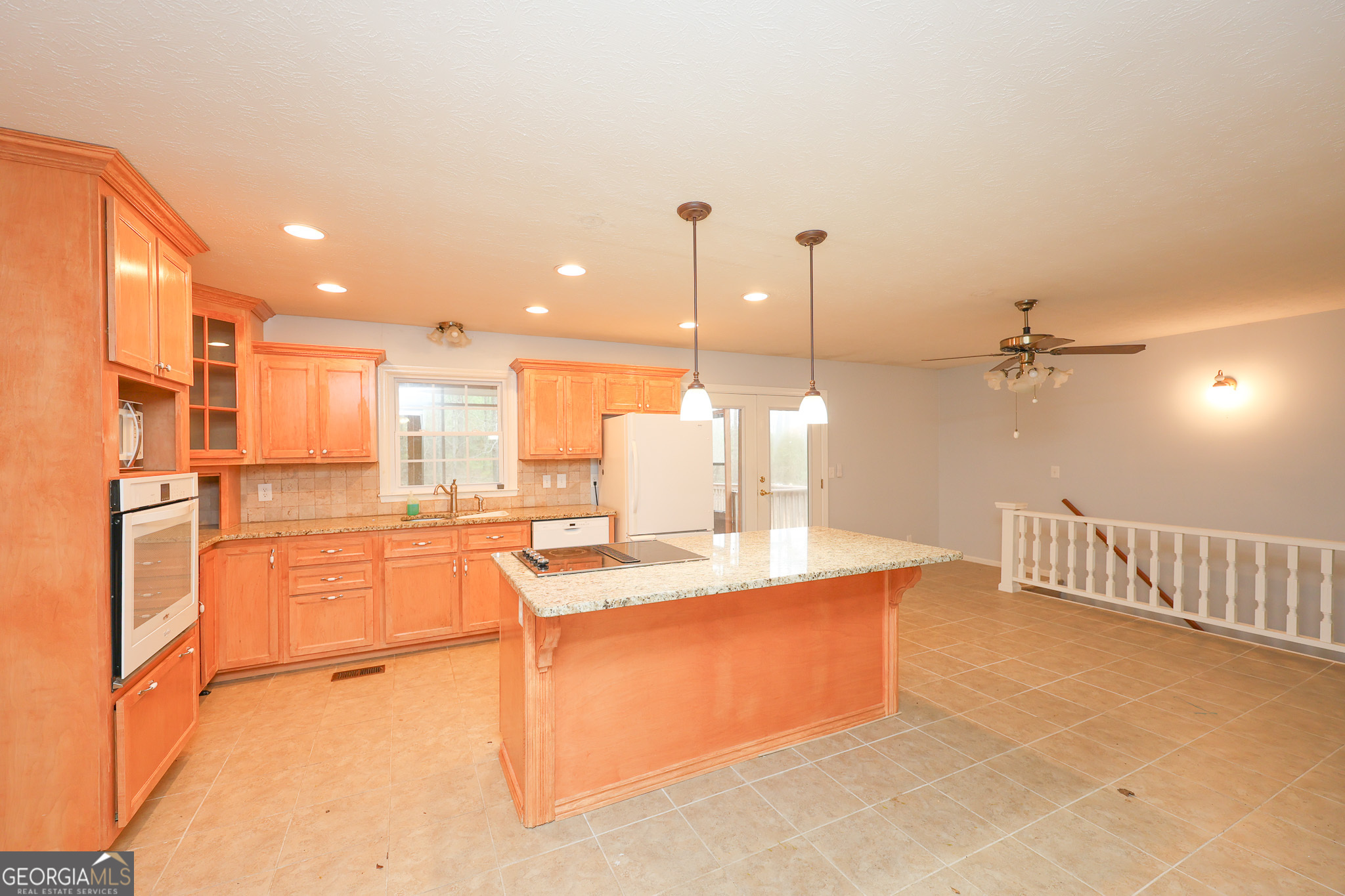 207 North View Pointe Drive LaGrange, GA 30241 - Photo 12 of 55 a kitchen with stainless steel appliances kitchen island granite countertop a sink and cabinets
