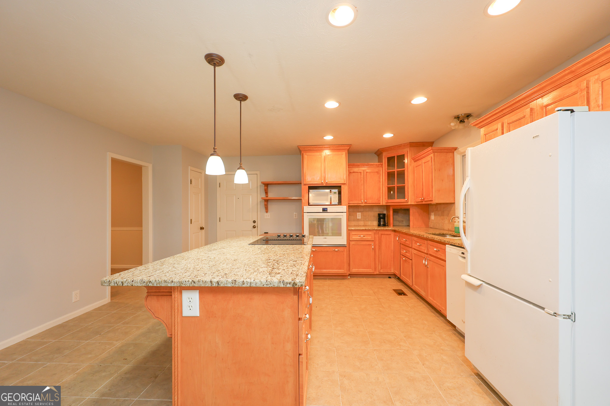 207 North View Pointe Drive LaGrange, GA 30241 - Photo 14 of 55 a kitchen with stainless steel appliances kitchen island granite countertop a refrigerator and a sink