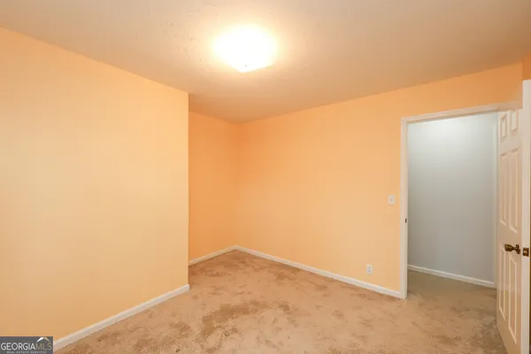 a kitchen with a sink cabinets and wooden floor